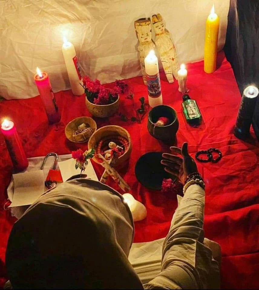 Candle-lit altar prepared for a traditional ritual
