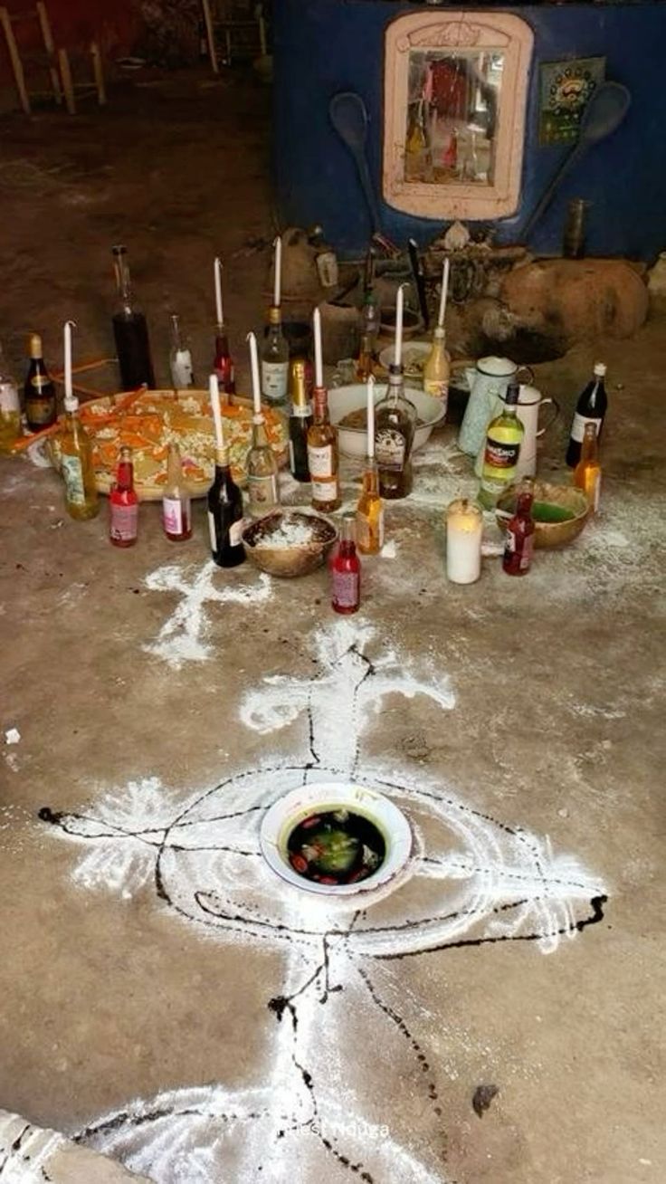 Candles and a chalk symbol arranged for a blessing ritual